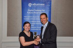 Holly Robinson winning digital marketing award from Matt Raad